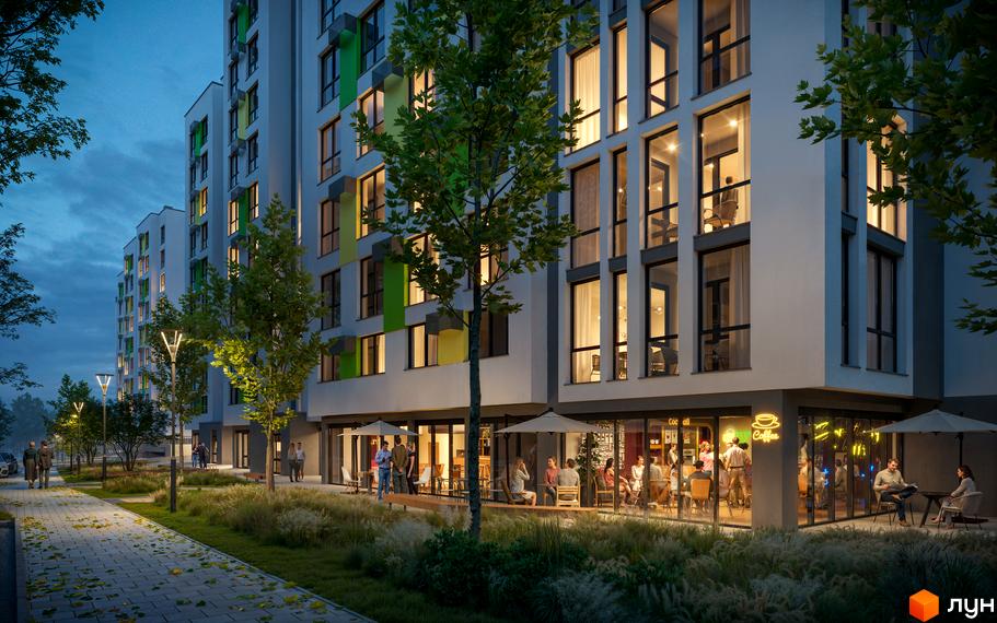Житловий комплекс Софіївка з яскравими фасадами та великими вікнами. Територія біля будинку облаштована місцями для відпочинку та освітленням.