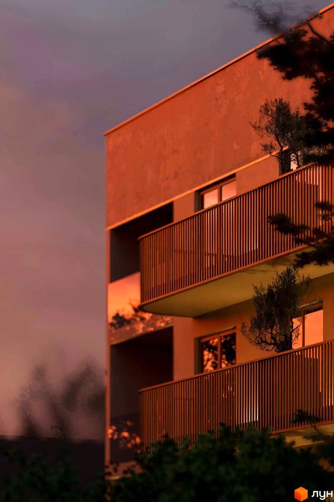 Зовнішній вигляд будинку ЖК Годинки з балконами та деревами на тлі вечірнього неба. Сучасний житловий комплекс з вишуканою архітектурою.