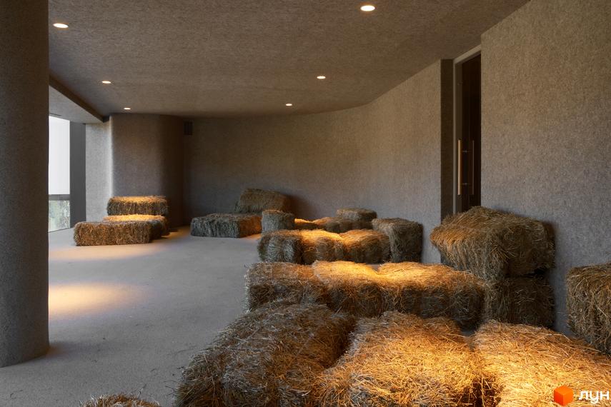Котеджне містечко Mountain Residence premium villas&spa: інтер'єр з тюками сіна, що слугують сидіннями, та приглушеним освітленням.