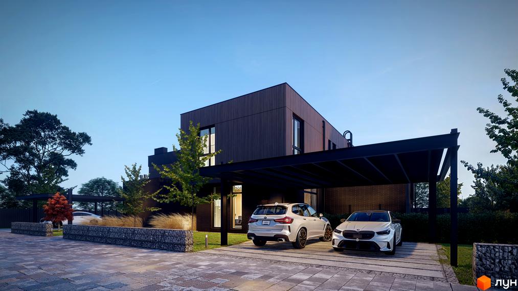 Двоповерховий будинок з темним фасадом та парковкою для автомобілів. На території є газон, декоративні елементи та бруківка.