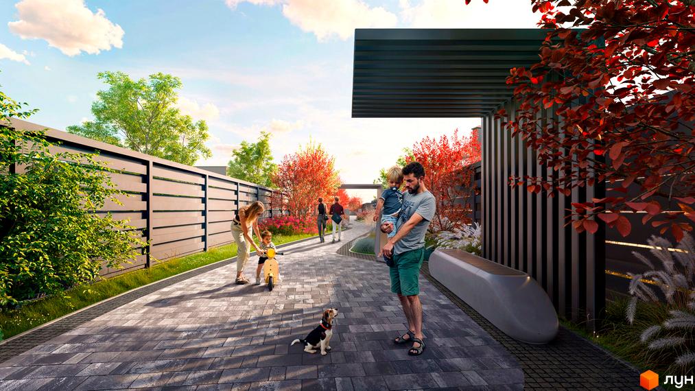 Котеджне містечко Piemont eco village з сімейним відпочинком на доріжці з бруківки біля паркану та червоних дерев.