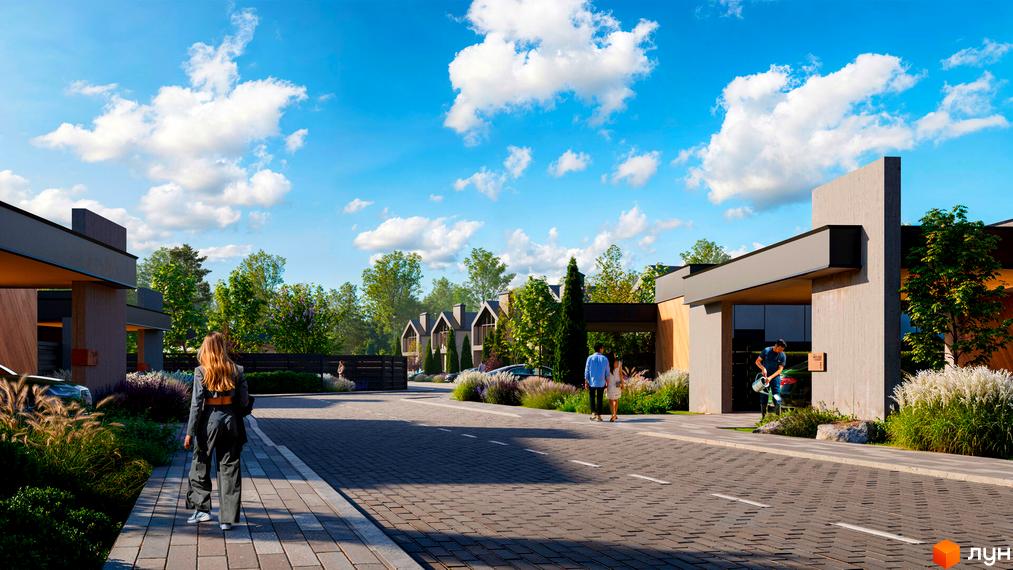 Котеджне містечко Piemont eco village з сучасними будинками та доглянутою прибудинковою територією. На зображенні видно дорогу, зелені насадження та людей.