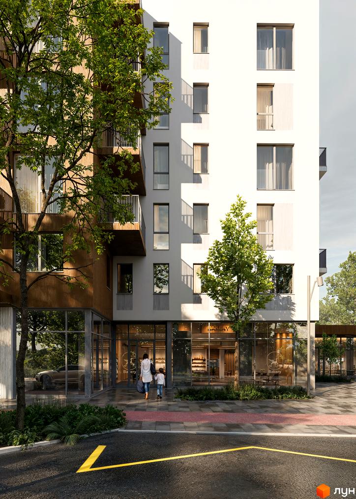 Зовнішній вигляд будинку ЖК Novolit з дерев'яними елементами фасаду та скляними вікнами. Прибудинкова територія з деревами та пішохідною зоною.