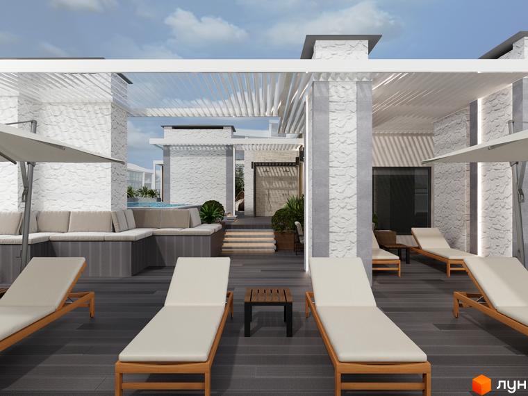 Білі кам'яні стіни та колони з перголами на даху Комплексу Breeze Marine. На прибудинковій території розташовані шезлонги, дивани та басейн.