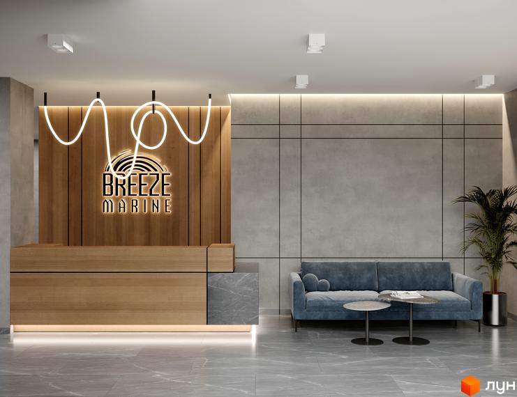 Вхідна група Апарт-комплексу Breeze Marine: лобі з дерев'яною стійкою реєстрації та зоною очікування.