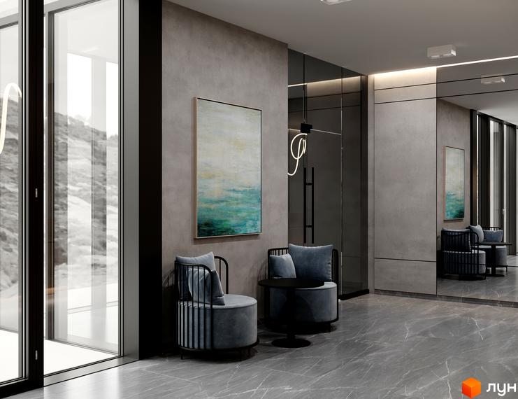 Інтер'єр лобі Апарт-комплексу Breeze Marine з великими вікнами та видом на засніжені гори. У приміщенні сірі стіни, мармурова підлога та зона відпочинку.