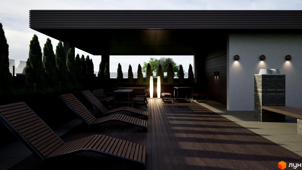 Житловий комплекс Fine Flats. Тераса з шезлонгами та зоною барбекю, оточена туями.