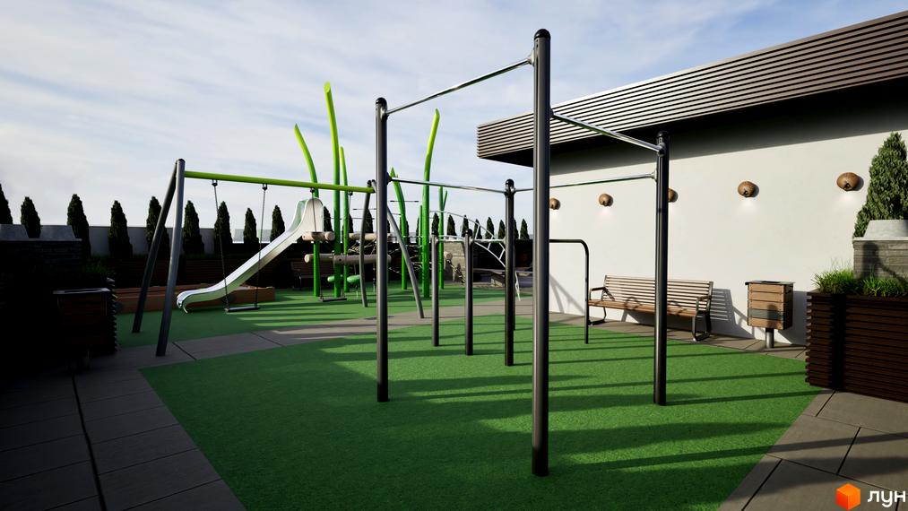Дитячий майданчик з гойдалками та гіркою на території житлового комплексу Fine Flats. Зона відпочинку з лавками та урнами біля стіни будівлі.
