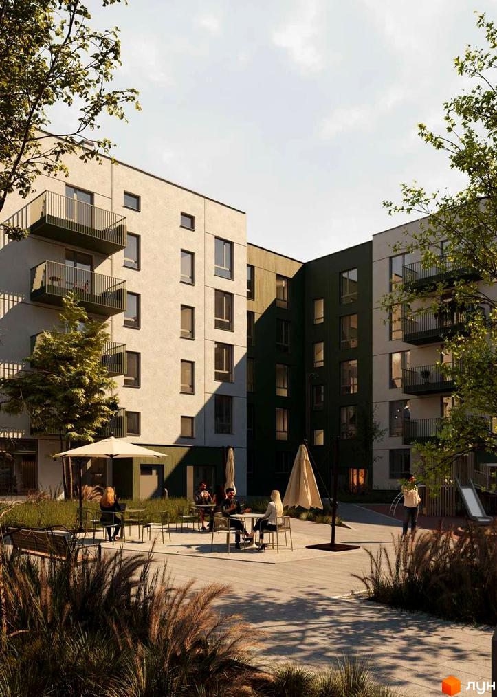 Житловий комплекс Смарагд. Фасад будинку з балконами та вікнами, прибудинкова територія з місцями для відпочинку та зеленню.