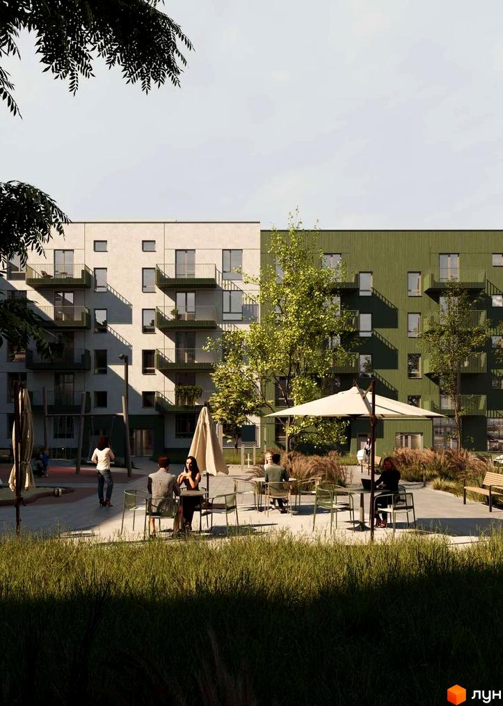 Житловий комплекс Смарагд: фасади будівель з балконами та зелена прибудинкова територія з місцями для відпочинку.