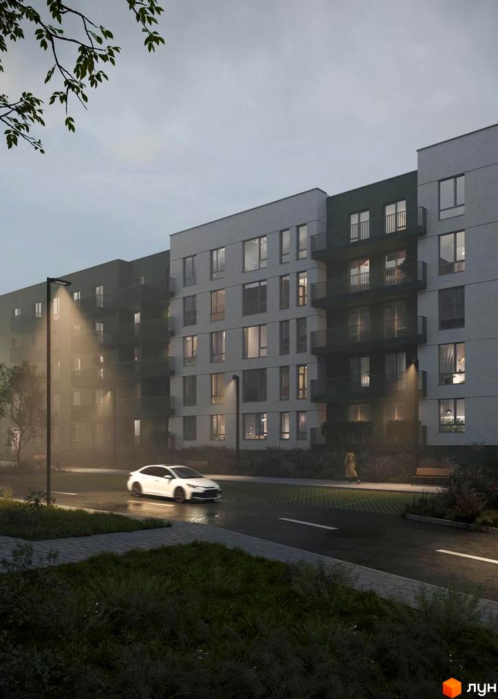 Житловий комплекс Смарагд. Зовнішній вигляд будинку з балконами та вікнами. Прибудинкова територія з дорогою, ліхтарями та деревами.