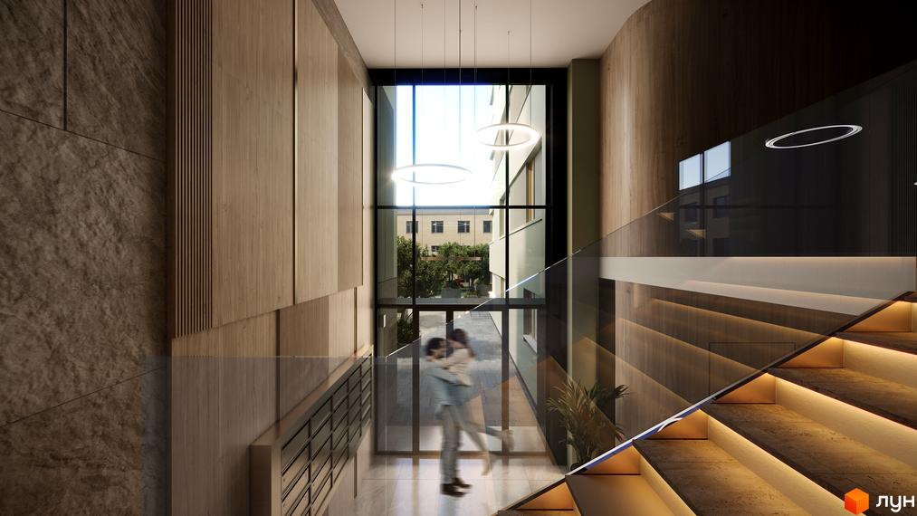Інтер'єр холу житлового комплексу PREMIUM HILLS з дерев'яними панелями та підсвіченими сходами. Велике вікно з видом на будівлі та дерева.