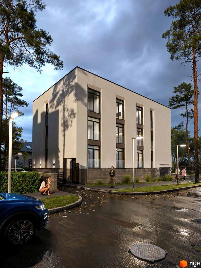 Будинок житлового комплексу The9 має світлий фасад та темні вікна. Навколо розташовані дерева та вуличне освітлення.
