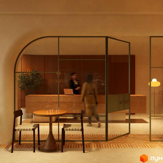 Апарт-готель PRAUD select. Інтер'єр рецепції з дерев'яною стійкою та зоною відпочинку з двома кріслами та столиком.