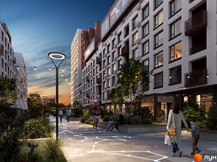 Житловий комплекс Зоряні: фасади будівель з балконами та вікнами, освітлена алея з ліхтарями та гірляндами, зона відпочинку з людьми.