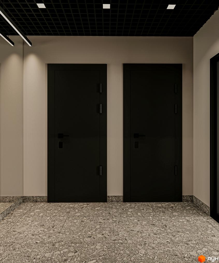 Дві чорні двері в коридорі ЖК Art Misto Smart. Підлога оздоблена сірою плиткою з вкрапленнями.