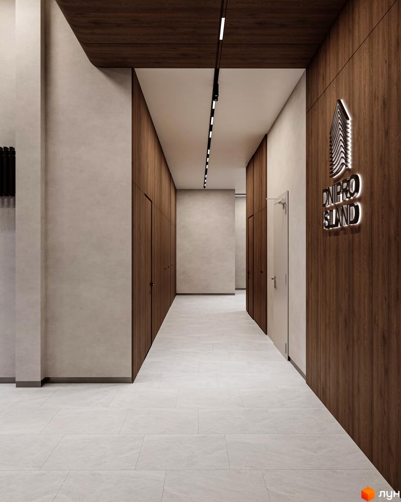 Стильний вхід у житловий комплекс Dnipro Island з дерев'яними панелями та підсвіченим логотипом. Просторий коридор з білою плиткою на підлозі.