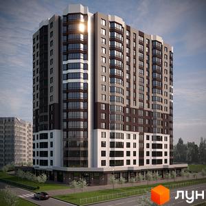 Багатоповерховий житловий комплекс на вулиці Сержанта Жужоми, 1, з коричнево-сірим фасадом та великою кількістю вікон. Перед будинком дорога з автомобілем та зелена зона з деревами.