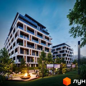 Житловий комплекс GLOBUS ECLIPTICA з балконами та скляними огорожами, оточений деревами та зоною відпочинку з вогнищем.