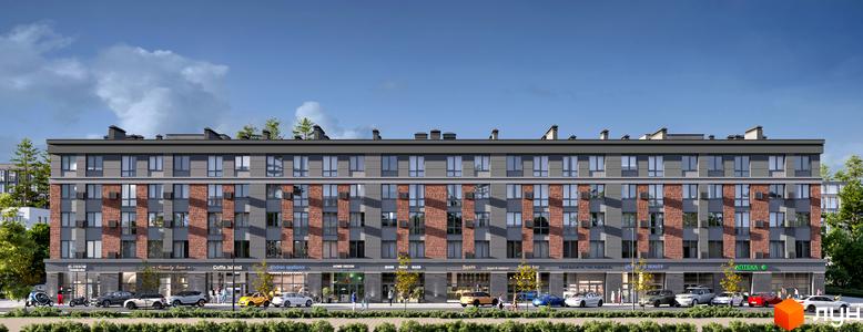 Фасад житлового комплексу Kvartal Soborna з цегляними та сірими вставками, вікнами та комерційними приміщеннями на першому поверсі. Перед будинком розташовані дерева, кущі та автомобілі.