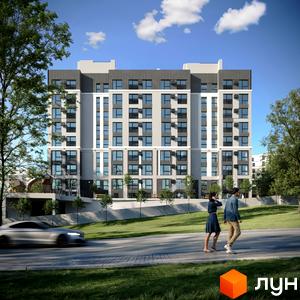 Житловий комплекс Смарагд - багатоповерхова новобудова з сірими та білими фасадами, великими вікнами та балконами. Навколо будинку зелена територія з деревами та дорогою.