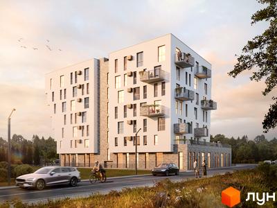 Новобудова Героїв Крут – це сучасна багатоповерхова будівля з балконами та великими вікнами. Територія навколо прикрашена деревами та дорогою з автомобілями та велосипедистами.