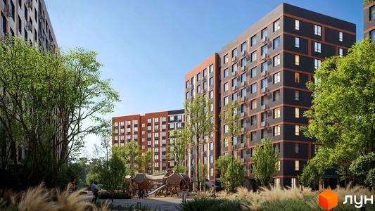 Житловий комплекс Happy 7: багатоповерхові будинки з темно-сірим фасадом та помаранчевими вставками, оточені зеленню та дитячим майданчиком.