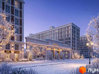 Багатоповерхові будинки Житлового комплексу OXFORD зі світлими фасадами та цегляними вставками. Прибудинкова територія вкрита снігом, прикрашена гірляндами та ліхтарями.