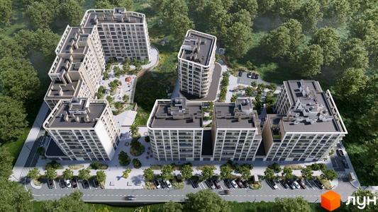 Житловий комплекс ШЕЛЕСТ: аерофотознімок будинків зі світлими фасадами та округлими формами, розташованих серед лісу з парковками та дитячими майданчиками.