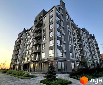Житловий комплекс Park Residence з сірими фасадами та балконами, прибудинкова територія з зеленими насадженнями та доріжками.