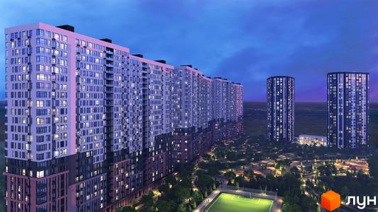 Високі будинки ЖК Star City з великою кількістю вікон, прибудинкова територія з зеленими насадженнями, спортивним майданчиком та освітленням.