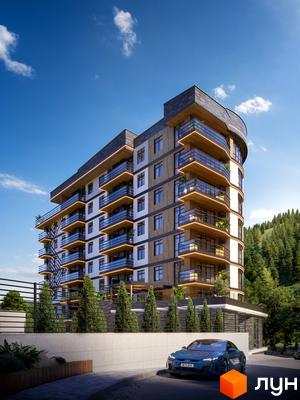 Skelya Residence - сучасний житловий комплекс з вигнутим фасадом, скляними балконами та підсвіткою. Навколо будинку зелена зона та зручний під'їзд.