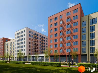 Зовнішній вигляд новобудови ЖК City House з фасадами різних кольорів та прибудинковою територією із зеленими насадженнями та доріжками.