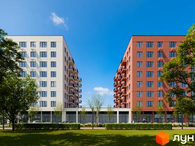 Зовнішній вигляд новобудови ЖК City House з цегляним фасадом та білим фасадом, зелена прибудинкова територія з деревами та газоном.