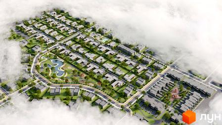 Котеджне містечко Gran Montaña: акуратні будинки з пласкими дахами та зелені зони з озером та дитячими майданчиками.