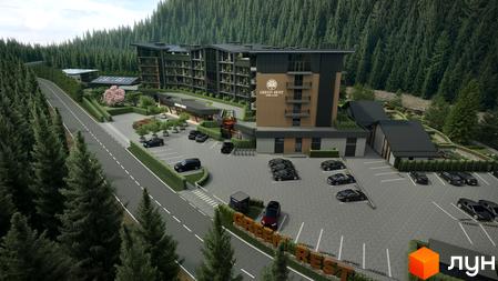 Зовнішній вигляд готелю Green Rest Hotel & Spa, розташованого серед лісу, з парковкою та дорогою. Оточений зеленню та деревами.