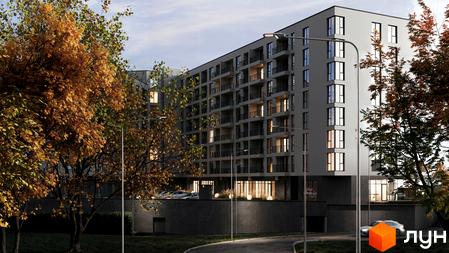 Житловий комплекс HILL SIDE з балконами та великими вікнами, оточений деревами восени. На передньому плані дорога та парковка.