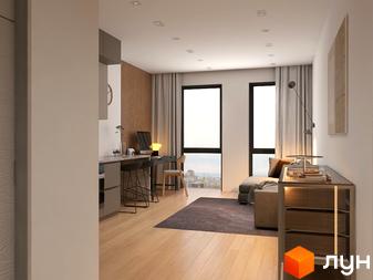 Інтер'єр квартири в БФК Shevchenka 58a з робочою зоною біля вікна та зоною відпочинку. Сучасний дизайн та панорамні вікна з видом на місто.