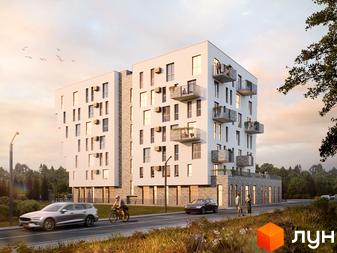 Новобудова Героїв Крут – це сучасна багатоповерхова будівля з балконами та великими вікнами. Територія навколо прикрашена деревами та дорогою з автомобілями та велосипедистами.