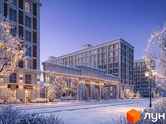 Багатоповерхові будинки Житлового комплексу OXFORD зі світлими фасадами та цегляними вставками. Прибудинкова територія вкрита снігом, прикрашена гірляндами та ліхтарями.