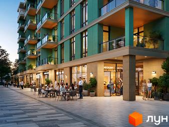 Зображення Житлового комплексу 44 Avenue: багатоповерховий будинок із зеленими фасадами та балконами, а також комерційні приміщення на першому поверсі з літніми терасами.