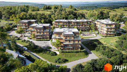 Житловий комплекс AURA: багатоквартирні будинки з дерев'яними фасадами та балконами, розташовані серед зелених насаджень з доріжками та дитячим майданчиком.