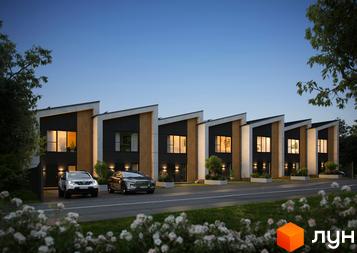 Ряд двоповерхових будинків з темними фасадами, дерев'яними вставками та похилими дахами. Перед ними дорога, газони та квітучі кущі.