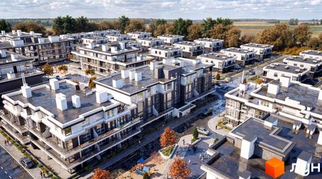 Зовнішній вигляд житлового комплексу KMParkWill з сучасними будівлями та доглянутою прибудинковою територією з дитячим майданчиком.