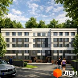 Житловий комплекс Comfort Hall: фасади будинку з темними та світлими панелями, великі вікна. Прибудинкова територія з парковкою та зеленими насадженнями.