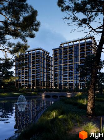 Житловий комплекс PARK AVENUE premium з підсвіченими фасадами та балконами, розташований біля озера з фонтаном та доглянутою прибудинковою територією.