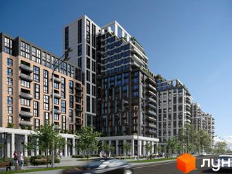 Багатоповерхові будинки Kaskad Residence з фасадами з цегли та світлого каменю, з балконами та озелененими дахами. Вздовж дороги облаштована пішохідна зона з деревами та лавками.
