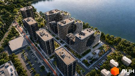 Житловий комплекс SvitLand Residences з висоти пташиного польоту, що складається з кількох висотних будівель з темними фасадами та білими балконами, розташований біля водойми та оточений деревами.