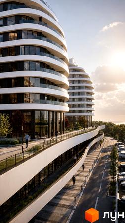 Житловий комплекс SvitLand Residences з вигнутими фасадами та скляними балконами, облаштована прибудинкова територія з доріжками та парковкою.