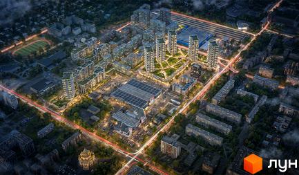 Житловий комплекс Dreamland: високі багатоповерхові будинки з освітленими вікнами та зеленими дахами, оточені парковими зонами та дорогами.